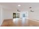 A bright, spacious living room with tile flooring and modern ceiling fans at 10430 42Nd N St, Clearwater, FL 33762