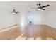 A spacious living room features tile flooring and modern ceiling fans at 10430 42Nd N St, Clearwater, FL 33762