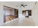 Bright sunroom with tile floor, ceiling fan, and sliding glass doors at 10430 42Nd N St, Clearwater, FL 33762