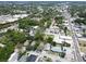 Beautiful aerial shot overlooking residential neighborhood with tree lined streets and commercial stores at 106 E Cedar St, Tarpon Springs, FL 34689