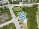 Aerial view of a neighborhood with pickleball courts and plenty of recreational green space at 106 E Cedar St, Tarpon Springs, FL 34689