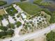 An aerial shot of a recreation area with a pool, playground, parking, and waterway access at 106 E Cedar St, Tarpon Springs, FL 34689