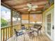 Inviting covered back porch with comfortable seating and a relaxing atmosphere at 106 E Cedar St, Tarpon Springs, FL 34689