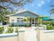 Charming single story home with a well-manicured front yard and welcoming entrance at 106 E Cedar St, Tarpon Springs, FL 34689