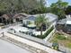 Charming home with a private front patio, lush landscaping, and a welcoming entrance at 106 E Cedar St, Tarpon Springs, FL 34689