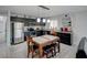 Stylish kitchen featuring modern appliances and an adjacent dining area at 106 E Cedar St, Tarpon Springs, FL 34689