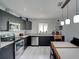 Sleek kitchen featuring stainless steel appliances and a large dining area at 106 E Cedar St, Tarpon Springs, FL 34689