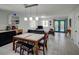 Bright living space with tile floors, pendant lighting, and stylish decor and outdoor access at 106 E Cedar St, Tarpon Springs, FL 34689