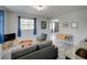 Cozy living area featuring a comfortable seating area with an archway leading to other rooms at 106 E Cedar St, Tarpon Springs, FL 34689