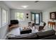 Bright living room featuring neutral tones, comfortable seating and an outdoor view at 106 E Cedar St, Tarpon Springs, FL 34689