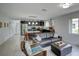 Open concept living space featuring a modern kitchen and a comfortable lounge area at 106 E Cedar St, Tarpon Springs, FL 34689