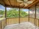 View of screened porch with ceiling fan and natural wood features, offering a relaxing outdoor space at 106 E Cedar St, Tarpon Springs, FL 34689