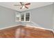 Bedroom has wood floors, neutral paint and a ceiling fan at 108 E Morgan St, Brandon, FL 33510
