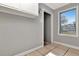 Hallway featuring neutral walls, tile flooring, and a window at 108 E Morgan St, Brandon, FL 33510