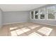 Bright living room with tiled floors, gray walls, and multiple windows at 108 E Morgan St, Brandon, FL 33510