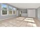 Bright living room with tiled floors, gray walls, and multiple windows at 108 E Morgan St, Brandon, FL 33510