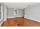 Spacious living room boasts wood floors and neutral walls, ideal for entertaining at 108 E Morgan St, Brandon, FL 33510
