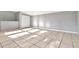 Bright living room featuring neutral walls, tile flooring, and closet at 108 E Morgan St, Brandon, FL 33510