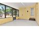 Bright sunroom with natural light and door to the exterior at 108 E Morgan St, Brandon, FL 33510