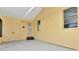 Bright sunroom with natural light, a door to the exterior, and paneled walls at 108 E Morgan St, Brandon, FL 33510