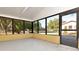 Bright sunroom with natural light, screens, and a door to the exterior at 108 E Morgan St, Brandon, FL 33510