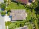 Aerial view showing the roof and yard of a property in a residential neighborhood at 10837 Breaking Rocks Dr, Tampa, FL 33647