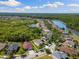 Aerial view of home highlighting the proximity to ponds and the surrounding landscape at 10837 Breaking Rocks Dr, Tampa, FL 33647