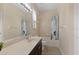 Bright bathroom with a single vanity, large mirror, and shower-tub combo at 10837 Breaking Rocks Dr, Tampa, FL 33647