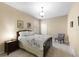 Inviting bedroom with a plush bed, soft lighting, and neutral color palette at 10837 Breaking Rocks Dr, Tampa, FL 33647