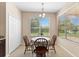 Bright dining area with natural light and a view to the exterior at 10837 Breaking Rocks Dr, Tampa, FL 33647