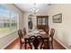 Formal dining room featuring hardwood floors and ample space for entertaining at 10837 Breaking Rocks Dr, Tampa, FL 33647