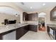 Stylish kitchen with stainless appliances, granite counters, and a tile backsplash at 10837 Breaking Rocks Dr, Tampa, FL 33647