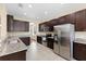 Spacious kitchen with stainless steel appliances, granite countertops, and ample cabinet space at 10837 Breaking Rocks Dr, Tampa, FL 33647