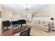 Comfortable living room with plush seating and a well-lit workspace at 10837 Breaking Rocks Dr, Tampa, FL 33647