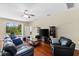 Bright living room with hardwood floors, patio access, and neutral decor at 10837 Breaking Rocks Dr, Tampa, FL 33647