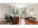 Bright office space with hardwood floors, natural light and modern decor at 10837 Breaking Rocks Dr, Tampa, FL 33647