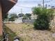 Back yard showing shed and fence, plus overgrown plants at 1100 Union S St, St Petersburg, FL 33712