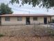 Modest single-story home featuring a simple facade, fenced front yard, and basic landscaping at 1100 Union S St, St Petersburg, FL 33712