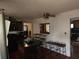 A modern kitchen features a dark island with seating and stainless steel appliances at 1100 Union S St, St Petersburg, FL 33712