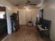 Bright living room features wood flooring, a ceiling fan, and ample natural light at 1100 Union S St, St Petersburg, FL 33712