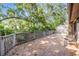 Spacious patio surrounded by lush greenery, ideal for outdoor entertaining and relaxation at 1103 Old Mill Pond Rd, Palm Harbor, FL 34683