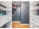 Walk-in closet with built-in shelving and drawers, perfect for organizing clothes and accessories at 1103 Old Mill Pond Rd, Palm Harbor, FL 34683