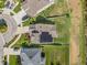 Aerial view of a home with solar panels and a well-manicured backyard at 11917 Greenchop Pl, Riverview, FL 33579
