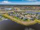 Aerial view of waterfront property in a residential neighborhood at 11917 Greenchop Pl, Riverview, FL 33579