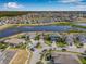 Aerial view of neighborhood featuring pond and community landscaping at 11917 Greenchop Pl, Riverview, FL 33579