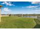 Well-maintained backyard with lush green grass and scenic water views at 11917 Greenchop Pl, Riverview, FL 33579