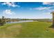 Expansive backyard with pristine landscaping and a tranquil lake view at 11917 Greenchop Pl, Riverview, FL 33579