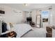 Bedroom with lots of natural light features a mirror, bed, and decor at 11917 Greenchop Pl, Riverview, FL 33579
