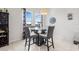 Bright breakfast nook with a modern round glass table and comfortable chairs at 11917 Greenchop Pl, Riverview, FL 33579