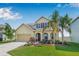 Charming two-story home with landscaped yard and attached two-car garage at 11917 Greenchop Pl, Riverview, FL 33579